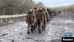 Ukrainian prisoners of war are seen during a swap for captured Russian soldiers at an undisclosed location in Ukraine, in this screengrab from a handout video released April 16, 2023. (Coordination Headquarters for the Treatment of Prisoners of War)