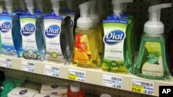 Soap bottles on a store shelf at a pharmacy.