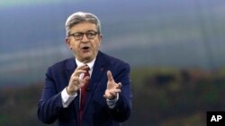 FILE - French Far-left presidential candidate for the 2022 election Jean-Luc Melenchon gestures as he speaks during a meeting in Nantes, France, Jan. 16, 2022.