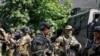 Members of foreign volunteers unit which fights in the Ukrainian army stand next to a vehicle in Sievierodonetsk, Luhansk region Ukraine June 2, 2022.