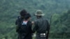 This photo taken on July 5, 2021 shows members of the Karenni People Defense Force (KPDF) during military training at their camp near Demoso in Kayah state. - In their camp hidden in the forested hills of Kayah state near the Thai border, Myanmar anti-junta volunteers practice f