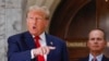 Former US President Donald Trump speaks to members of the media during the third day of his civil fraud trial in New York on October 4, 2023.