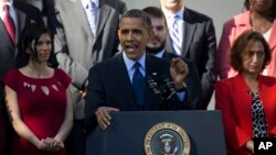 President Barack Obama gestures while speaking about the initial rollout of the health care overhaul, in the Rose Garden of the White House in Washington, Oct. 21, 2013.