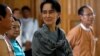 National League for Democracy (NLD) party leader Aung San Suu Kyi smiles as she arrives to attend Union Parliament in Naypyitaw January 28, 2016. REUTERS/Soe Zeya Tun - RTX24BTR