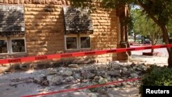 Stonework litters the sidewalk outside an empty jewelry store at the corner of Sixth and Harrison in Pawnee, Oklahoma, after a 5.6 magnitude earthquake struck near the north-central Oklahoma town, Sept. 3, 2016.