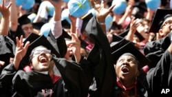 Students celebrate after graduating from Harvard University on May 28, 2015, in Cambridge, Massachusetts. 