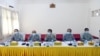 Members of the Union Election Commission wear face masks during a press conference, announcing that general elections in Myanmar will proceed as planned in November despite coronavirus concerns, in Naypyitaw, Myanmar, June 4, 2020. © 2020 AP