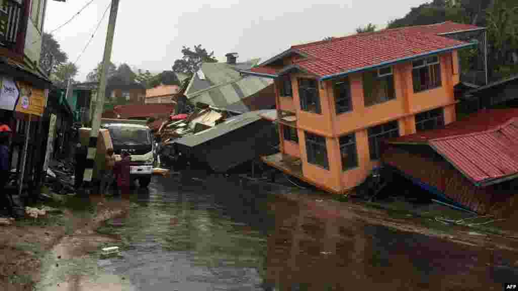 Apartments are destroyed following a landslide due to heavy rain in Harkhar, Chin State of Myanmar, July 30, 2015.