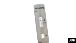 A Covid-19 antigen self-test kit shows a positive case on January 13, 2022 