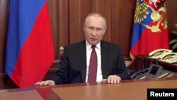 FILE PHOTO: Russian President Vladimir Putin delivers a video address in Moscow