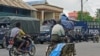 A man wearing a protective face mask rides a bicycle amid the outbreak of the coronavirus disease (COVID-19), in Sittwe, Rakhine State, Myanmar August 27, 2020. REUTERS/Stringer NO RESALES NO ARCHIVES