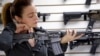 A gun shop owner demonstrates a Ruger AR-15 semi-automatic rifle, Nov. 7, 2017, in Lynnwood, Wash.