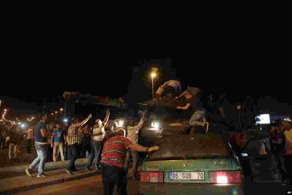 Tanks move into position as Turkish people attempt to stop them, in Ankara, Turkey, July 15, 2016. 