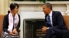 U.S. President Barack Obama speaks with Myanmar opposition leader Aung San Suu Kyi 