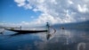 An ethnic Inntha fishermen on boats use their fishing net in Inlay lake, Nyaung Shwe township, southern Shan State, Myanmar, Wednesday, Oct. 1, 2014. 