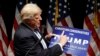 Campaign 2016 Trump: Republican presidential candidate Donald Trump holds up a "Christian Conservatives for Trump" sign at a rally, Wednesday, Sept. 28, 2016, in Council Bluffs, Iowa.