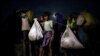 FILE PHOTO: Rohingya refugees continue their journey after crossing the Myanmar-Bangladesh border in Palong Khali, Bangladesh, November 1, 2017. REUTERS/Hannah McKay/File Photo FROM THE FILES - 3RD ANNIVERSARY OF ROHINGYA MUSLIM EXODUS FROM MYANMAR