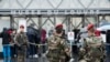 France Louvre AttackFrench soldiers patrol in the courtyard of the Louvre museum with the visitor control in background in Paris, Feb. 4, 2017. The Louvre in Paris reopened to the public Saturday morning, less than 24-hours after a machete-wielding assai