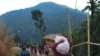 People displaced by fighting in north-western Myanmar between junta forces and anti-junta fighters walk in Chin State, Myanmar, May 31, 2021. Picture taken May 31, 2021. REUTERS/Stringer