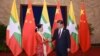 Myanmar State Counsellor Aung San Suu Kyi (L) shakes hands with Chinese President Xi (MOI)