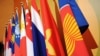 The Association of the Southeast Asian Nations (ASEAN) flag, right, leads the flags of the 10 member countries during the ASEAN Regional Forum meeting in Singapore.