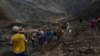 Rescuers recover bodies near the landslide area in the jade mining site in Hpakant in Kachin state on July 2, 2020. - The battered bodies of more than 120 jade miners were pulled from a sea of mud after a landslide in northern Myanmar on July 2 after one 