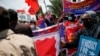 Activists hold placards and banners during a protest to support the anti-coup movement and democracy in Myanmar, near the Association of Southeast Asian Nations (ASEAN) secretariat building, ahead of the ASEAN leaders' meeting in Jakarta, Indonesia April 