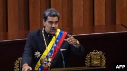 Venezuelan President Nicolas Maduro delivers a speech before the judges of the Supreme Court of Justice during the opening ceremony of the judicial year in Caracas on January 31, 2024. (Photo by Pedro Rances Mattey / AFP)