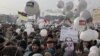 Demonstrators gather for a massive protest against Prime Minister Vladimir Putin's rule in Bolotnaya square in Moscow, Saturday, Feb. 4, 2012 . Thousands of Russians are taking to the streets of Moscow to demand an end to Prime Minister Vladimir Putin's 