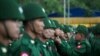 (FILES) In this file photo taken on February 12, 2020, members of the Myanmar military honour guard take part in a ceremony to mark the 73rd National Union Day in Yangon. - Myanmar's army chief has raised on January 27, 2021 the prospect of scrapping the 